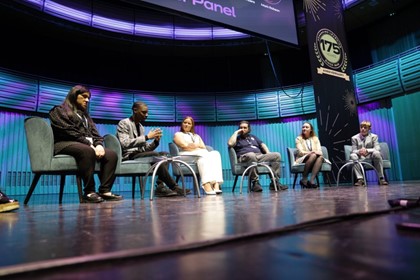 NCFE learners seated on stage taking part in a panel discussion