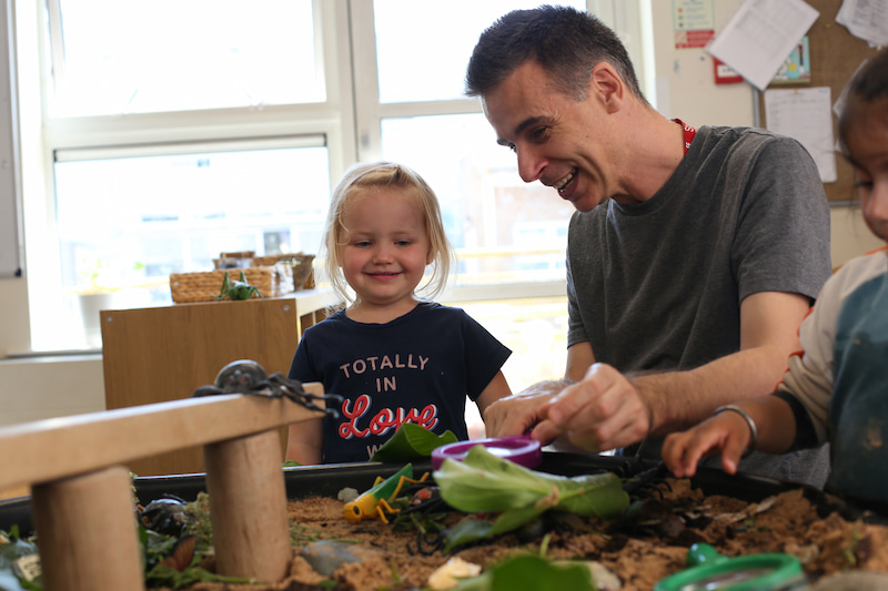 A Male And Child Laughing